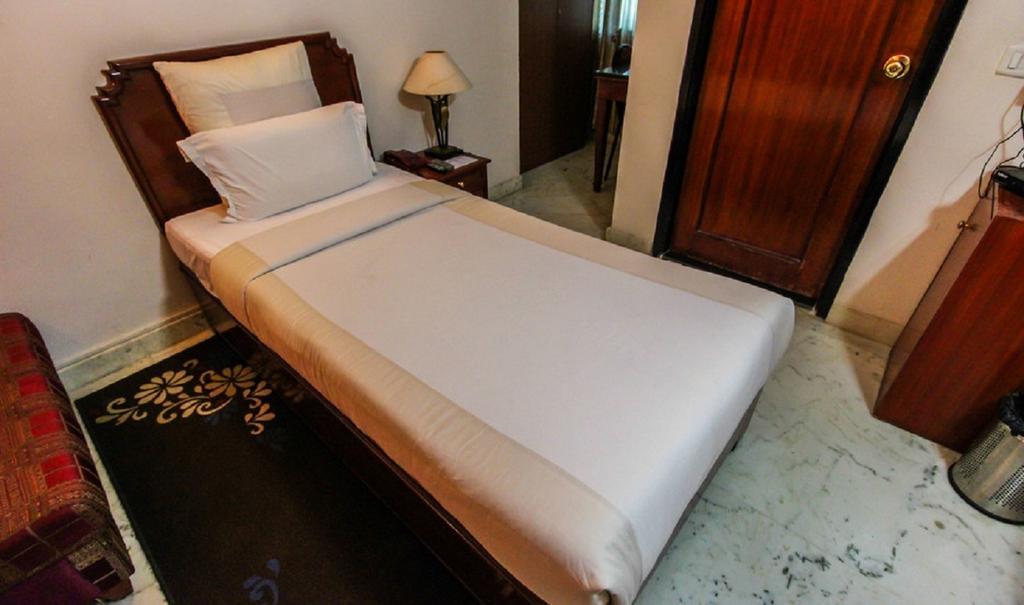 Hotel Pigeon International Bangalore Zimmer foto