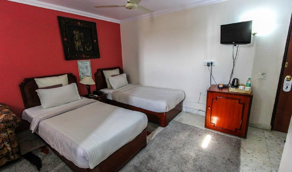 Hotel Pigeon International Bangalore Zimmer foto