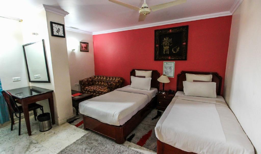 Hotel Pigeon International Bangalore Zimmer foto